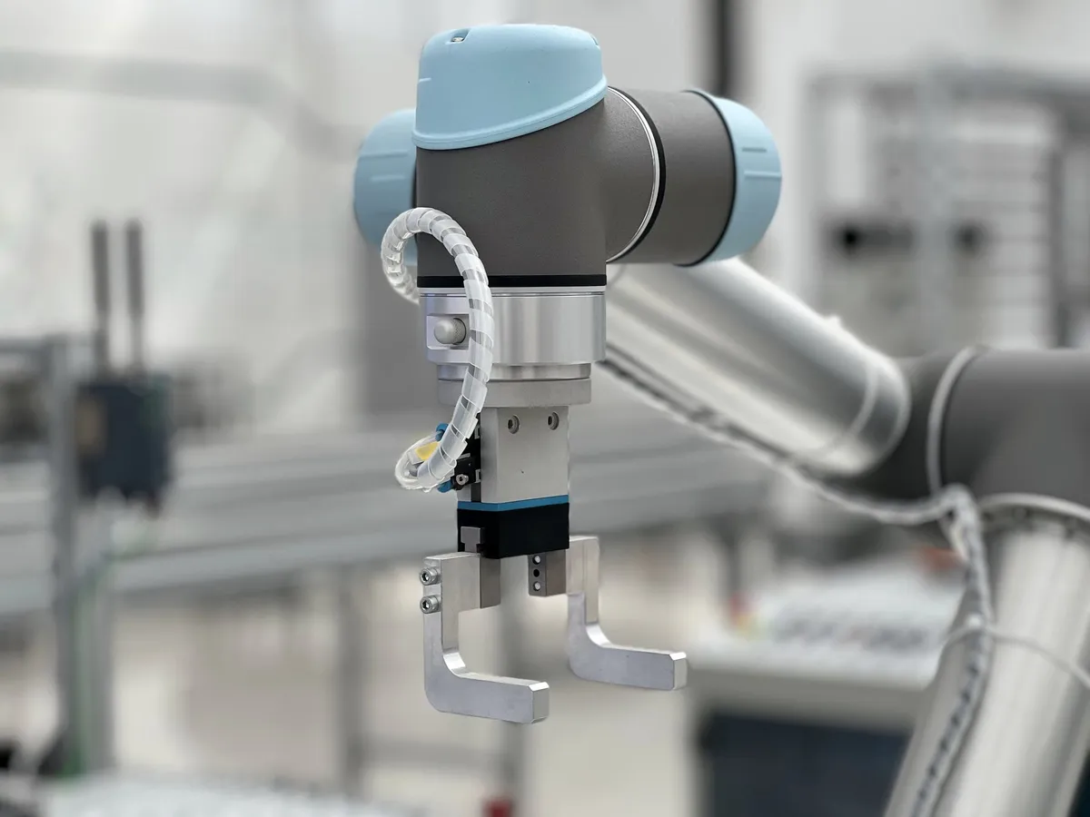 Collaborative robot arm in a modern factory
